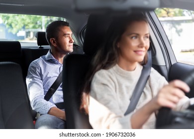 Transportation, Vehicle And People Concept - Happy Smiling Female Driver Driving Car With Male Passenger