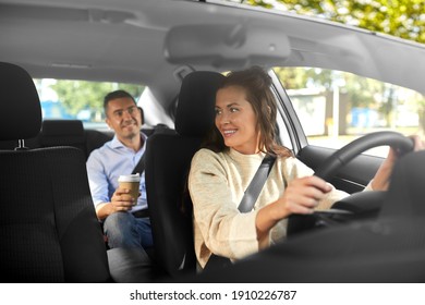 Transportation, Vehicle And People Concept - Happy Smiling Female Driver Driving Car With Male Passenger