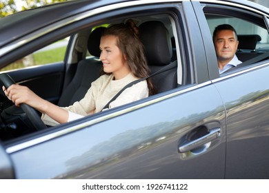 Transportation, Vehicle And People Concept - Happy Smiling Female Driver Driving Car With Male Passenger