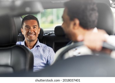 transportation, vehicle and people concept - happy smiling middle aged male passenger talking to taxi car driver