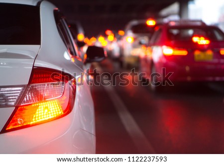 transportation vehicle and traffic concept - Blurred traffic jam and brake light in bangkok, thailand on evening