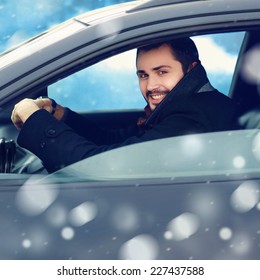 Transportation, Winter And People Concept - Closeup Happy Smiling Man Driver Behind The Wheel Of His Car