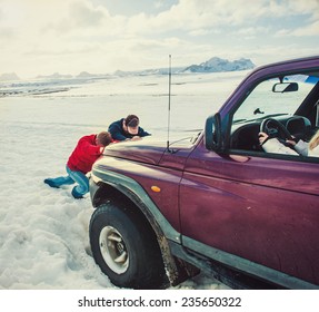 Transportation, Winter And Vehicle Concept - Closeup Of Car Wheel Stuck In Snow