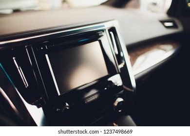 Transportation,technology and vehicle concept - man using car system control pushing panel button touch screen interface modern design,GPS and DVD ,Vintage color.
