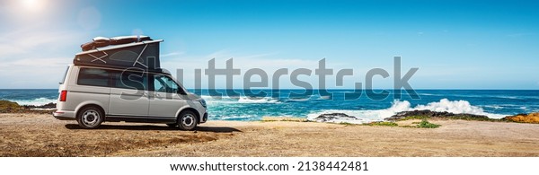 Transporter Camping Van bus at the California Ocean in\
the coastal Nature 