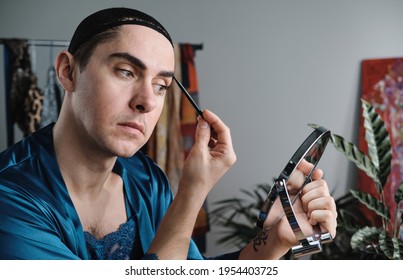 Transsexual Applying Makeup On His Face In The Morning And Preparing For New Day