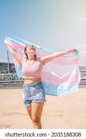 Transsexual Woman With Trans Flag, Holding A Transgender Pride Flag. High Quality Photo