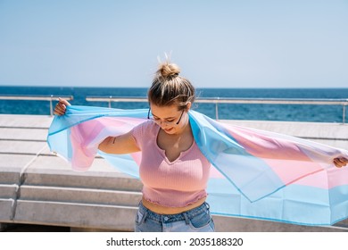 Transsexual Woman With Trans Flag, Holding A Transgender Pride Flag. High Quality Photo