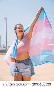 Transsexual Woman With Trans Flag, Holding A Transgender Pride Flag. High Quality Photo