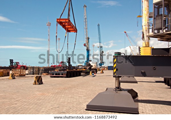 Transshipment terminal for loading steel products\
to sea vessels using shore cranes and special equipment in Port\
Pecem, Brazil, June,\
2017.