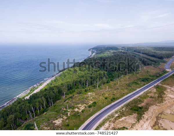 Trans-Siberian Railway on the Baikal lake shore from\
aerial view