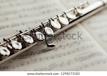 transverse flute on music sheet