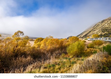 Tranzalpine Train In New Zealand Mountains