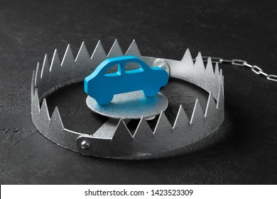 Trap With Bait Car. The Risk Of Buying Bad Car. Car Insurance. Black Background