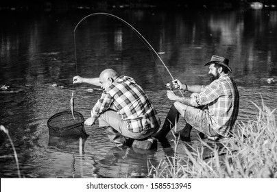 Trap For Fish. Men Sit At Riverside With Fishing Equipment. Illegal Hunting Caviar. Extracts Eggs From Sturgeon Caught River. Poaching Crime And Fishing License. Black Market Caviar. Poachers Fishing.