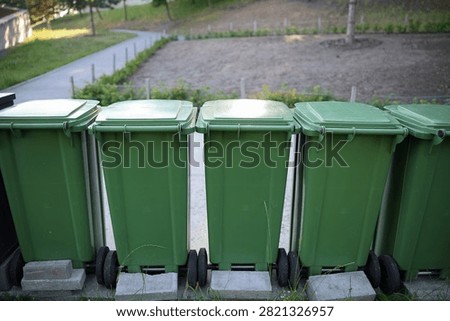 trash bin, container, receptacle, plastic, polymer, lid, wheels, street, courtyard, city