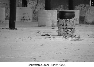 A Trash Can Beneath A Boardwalk In Galveston, Texas.