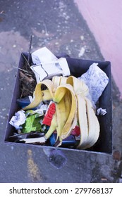 Trash Can With Garbage Inside