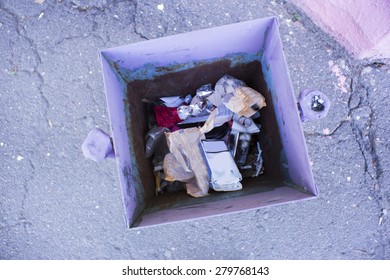 Trash Can With Garbage Inside