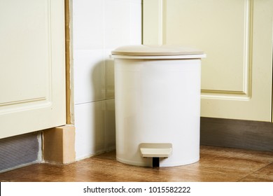 Trash can in the kitchen corner