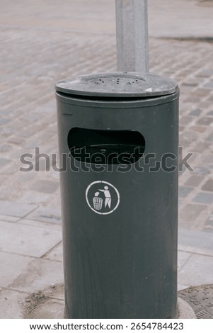 trash can marked Do not litter. green round container for waste collection. garbage sorting, eco-friendly care of nature. recycling and disposal of harmful and toxic waste.