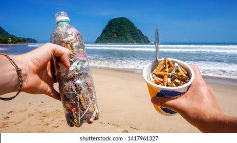 Trash Collected From The Pictured Beach Presented In Single Use Plastic Items. All Rubbish Found In The Sand And Sea. Representing The Pollution In Our Oceans Today Which Kills Marine Life Worldwide