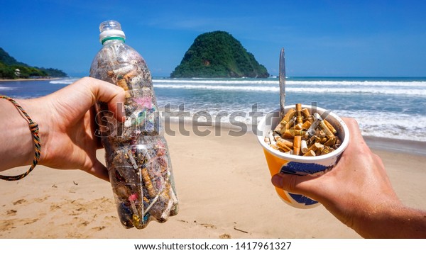 Trash collected from the pictured beach\
presented in single use plastic items. All rubbish found in the\
sand and sea. Representing the pollution in our oceans today which\
kills marine life\
worldwide