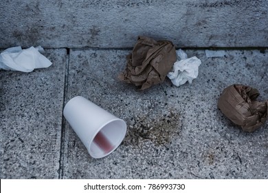 Trash On The Street - Wrinkled Paper Bags And Knocked Over Paper Cup With Wine