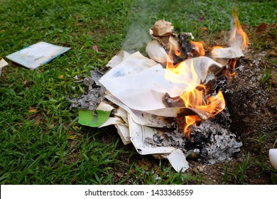 Trash And Paper Are Burning In The Fire