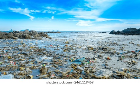 trash, plastic cups and plastic bags at the beach.environmental problem concept and healing the world - Powered by Shutterstock