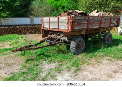 Trash Trailer In The Rustic Yard . Trailer From A Tractor In The Village