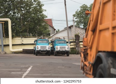 trash truck or dump-truck municipality sanitation salubrity truck fleet of city vehicles for urban garbage collector service with retro car transportation for sanitation services to city residents - Shutterstock ID 1242295753