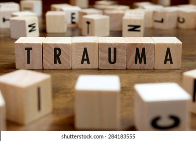 Trauma Word Written On Wood Block