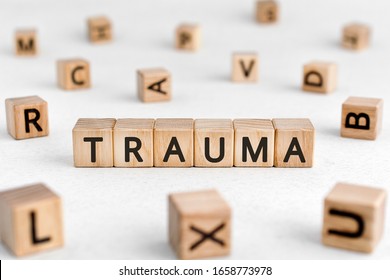 Trauma - Words From Wooden Blocks With Letters, Physical Or Mental Injury Trauma Concept, White Background