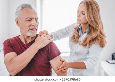 Traumatology, orthopedist concept. Medical examination on patient shoulder in clinic. Injury and dislocations. Reflexology and physiotherapy for elderly people - Powered by Shutterstock