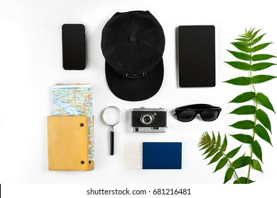 Travel Accessories Set On White Background: Smart, Passport, Cap, Notepad, Map, Camera And Sunglasses. Top View Point.