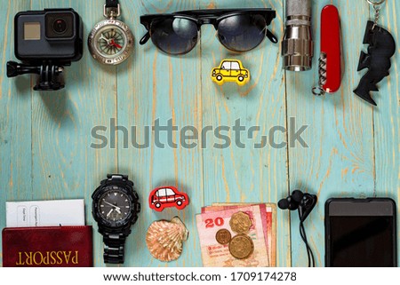 Travel accessories for trip on wooden background