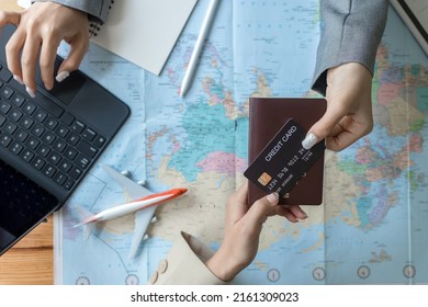 Travel Agent Giving Client Documents For Future Trip In Office.