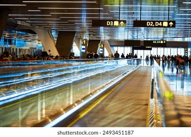 Travel, airport and terminal for departure or arrival with boarding gate, signage or passenger for immigration. Walkway, path and people in waiting area for international flight or delay in flight - Powered by Shutterstock