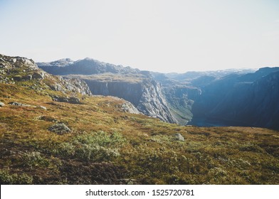 Travel around Norwegian national park at autumn season, hiking in mountains.