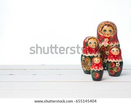 Travel around the world for your colorful life .Enjoy the funny trip journey .Top view for copy space some idea your create destination .object  cute  ,  Set of matrioshka dolls on color background.