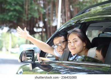 Travel Asian Family Preparing With Her Son In The Car