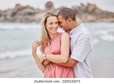 Travel, Beach And Couple Hug, Happy And Laughing While Bonding Outdoors, Enjoying The View Of The Ocean. Love, Relationship And Water Fun With Relax Man And Woman On Seaside Trip In San Francisco