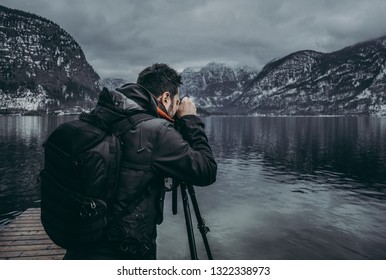 Travel Blogger Taking Picture Of Mountain Landscape