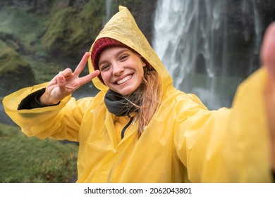 Travel Blogger Woman Showing Peace Gesture While Taking Self Portrait