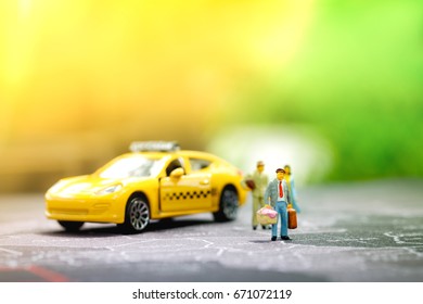  travel or business concept, miniature backpacker on map with taxi.
