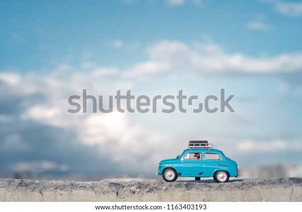 Travel by car with\
luggage on the roof