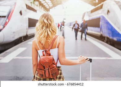 Travel By Train, Woman Passenger With Suitcase Waiting In Railway Station