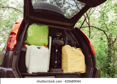 Travel And Camping Luggage Packed In The Car Trunk. Outdoor Wanderlust Items. Outdoor, Adventures And Travel Suv. Ready To Go Concept. Expedition, Exploring Swag And Storage.   