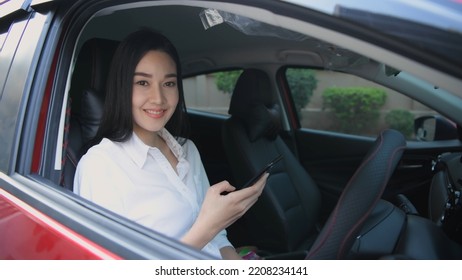 Travel Concept Of 4k Resolution. Young Women Playing Mobile Phones In The Car.